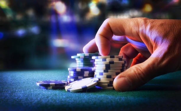 Live dealer dealing cards at the nos69 login Casino Hold'em table
